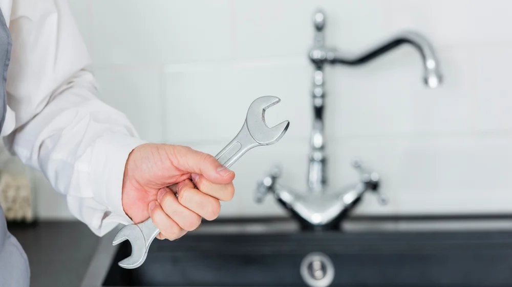 tap repair service with plumber using tools
